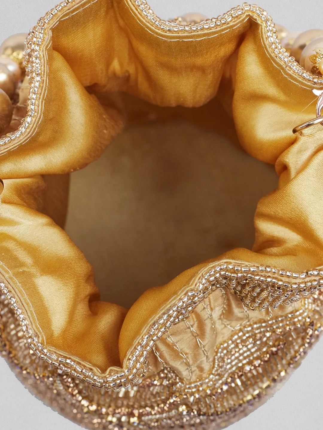 Rubans Golden Coloured Potli Bag With Golden Embroided Design.