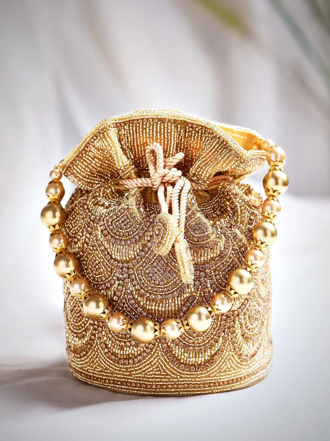 Rubans Golden Coloured Potli Bag With Golden Embroided Design.